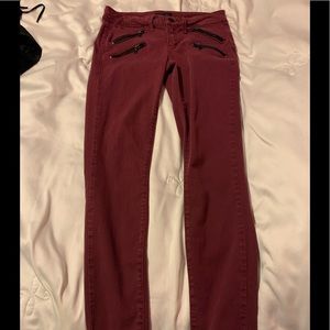 Bebe burgundy zippered skinny jeans